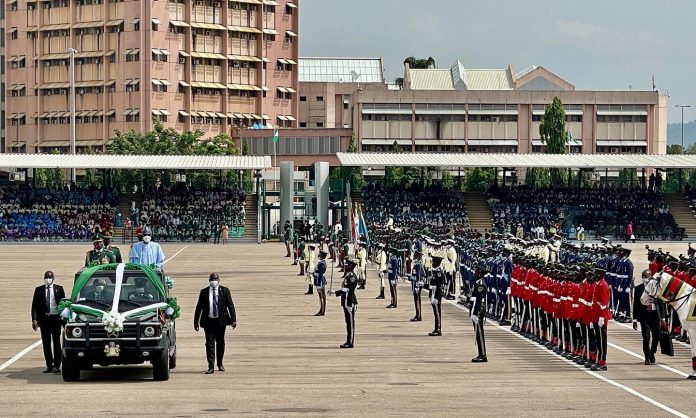 Three Military Officers Slump During Democracy Day Parade