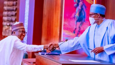 President Buhari swears In New RMAFC Boss